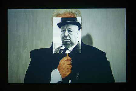 1. John Conomos, Performance as Mr Hitchcock with face mask, Part 2, 2016. Sound, colour, black and white video, 9 minutes. 